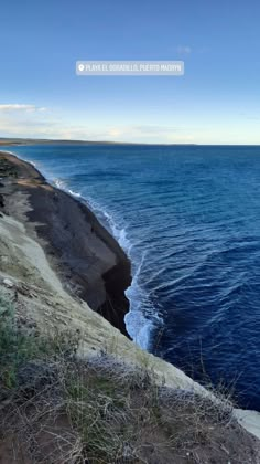 the ocean is blue with waves coming in to shore