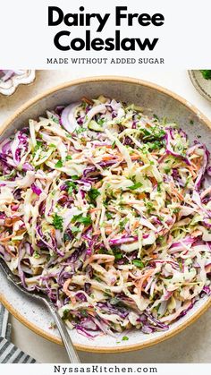 a bowl filled with coleslaw and garnished with parsley on the side