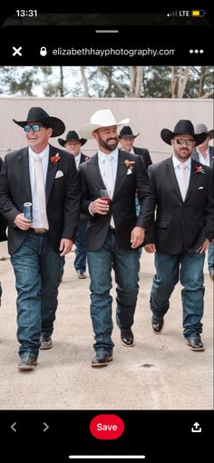 a group of men in suits and hats walking together