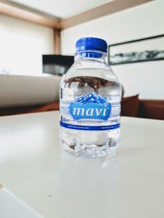 a bottle of water sitting on top of a table