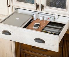 an open laptop computer sitting on top of a wooden desk