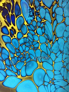 an image of blue and yellow glass art work