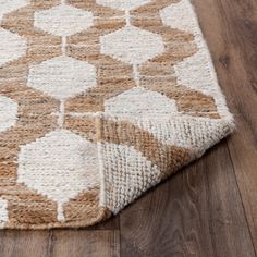 a brown and white rug on the floor