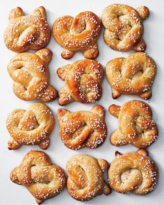 several pretzels are arranged on a white surface