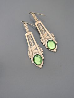 "Vintage Jewelry - Art Deco Inspired Earrings - Crystal Earrings - Bridal Earrings - Gold Earrings - Green Earrings - handmade Jewelry So gorgeous! Awesome Art Deco inspired earrings embellished with three sparkling green vintage crystals. Gold plated. Would be perfect for your wedding. Chloe says, \"Wear them and feel fabulous!\" They measure just over 2 1/2\" long. Thanks for visiting Chloe's" Art Deco Hallmarked Drop Earrings, Green Sterling Silver Art Deco Jewelry, Formal Green Nickel-free Earrings, Art Nouveau Dangle Earrings Gift, Art Nouveau Dangle Earrings For Gifts, Art Deco Style Pierced Drop Earrings, Art Deco Pierced Drop Earrings, Art Deco Jewelry With Matching Earrings For Gifts, Art Deco Jewelry With Matching Earrings As Gift