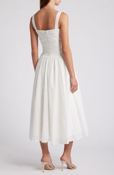 Eyelet and ribbon lacing adds an edgy touch to a vintage-inspired sundress boasting a bustier-style bodice and flared midi skirt. Exclusive retailer Square neck Side patch pockets Lined 77% viscose, 21% polyester, 2% elastane Dry clean Imported Elopement Dresses, Flared Midi Skirt, Halter Sundress, Midi Flare Skirt, Elopement Dress, Midi Sundress, House Of Cb, Floral Sundress, Lace Corset