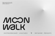 the moon walk logo is displayed on a white wall