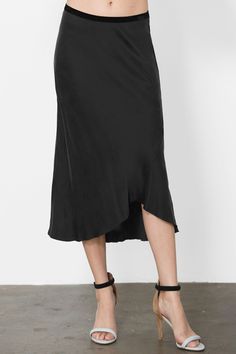 Go Silk Go Luxe Bias Skirt in Black is easy to dress up for an occasion, stylized work skirt and comfortable vacation skirt. The luxe skirt features a bias-cut midi skirt with curve to accentuate in the most flattering of ways. Asymmetrical hem that falls below the knee with a seamed hemline. Slip on with a velvet elastic waistband. 100% silk charmeuse. FINAL SALE! Vacation Skirt, Vacation Skirts, Bias Skirt, Work Skirt, Clare Vivier, Melissa Joy Manning, Work Skirts, Scarf Top, Silk Charmeuse