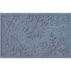 a blue door mat with snowflakes on it