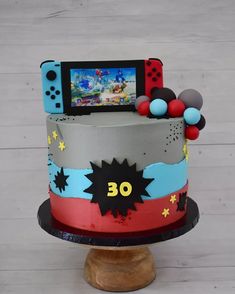 a birthday cake with a video game controller on top