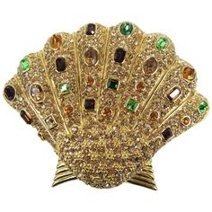 Multi-Colored Swarovski Crystals set in this massive Ciner Brooch. Measuring 2.89 inches or 73.54 mm wide x 2.27 inches or 57.77 mm top to bottom. We have more Ciner items on our storefront along with hundreds of NEW OLD STOCK Designer Jewelry. This is out of a massive collection of Contemporary designer clothing as well as Hopi, Zuni, Navajo, Southwestern, sterling silver, costume jewelry and fine jewelry from one collector. Be sure to check our storefront for more fabulous pieces from this col Ciner Jewelry, Shell Brooch, Bvlgari Jewelry, Valentino Couture, Shell Decor, Mid Century Jewelry, Art Deco Pattern, Beaded Handbag, Couture Jewelry