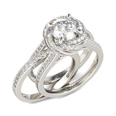 an engagement ring set with two matching bands and a center stone surrounded by round brilliant cut diamonds