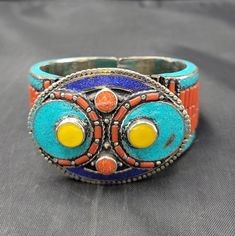 Handmade Beautiful Vintage Silver Bangle Bracelet With Natural Turquoise And Coral Lapis and Yellow Copal Gemstone it's Totally Handmade Material Silver  Gemstone Turquoise And Coral Lapis Lazuli And Copal  Size 7Cm Adjustable Turquoise Bracelets For Festivals, Traditional Blue Bracelets With Natural Stones, Handmade Turquoise Bracelets For Festivals, Turquoise Bracelet Jewelry For Festivals, Traditional Turquoise Round Bracelets, Traditional Turquoise Beaded Bracelets, Traditional Turquoise Round Bracelet, Traditional Round Turquoise Bracelet, Traditional Turquoise Beaded Bangle Bracelets