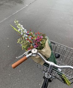 a bicycle with flowers in the front basket