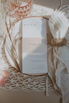 a menu sitting on top of a table next to a glass cup and saucer