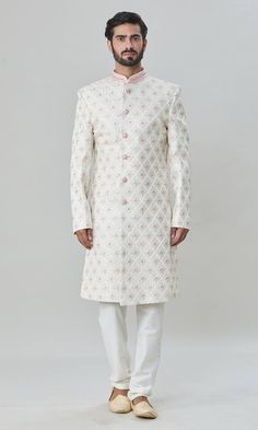 Off-white sherwani with floral and thread embroidery. Comes with pant. - Aza Fashions Designer Off White Sets With Zari Work, Designer White Sherwani With Cutdana, White Straight Kurta Bandhgala For Wedding, Elegant White Bandhgala Straight Kurta, Designer Traditional Wear With Resham Embroidery In Off White, Designer Off White Traditional Wear With Resham Embroidery, Designer White Bandhgala With Traditional Drape, Designer White Sets With Cutdana, Designer White Sets For Diwali