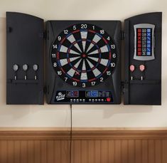 a dart board mounted to the side of a wall with two darts in front of it