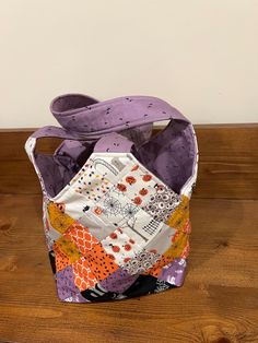 This bag is made using the Mondo/Midi pattern.  It's 12" deep with an 8" square bottom, shoulder straps and a pocket in the side.  This bag is very steady and will hold many items.  Even though it's a Halloween theme, it's fun and cute and can be used year round. Square Hobo Bag For Daily Use, Square Bucket Bag With Top Carry Handle, Purple Square Satchel For Everyday Use, Square Purple Satchel For Everyday Use, Purple Square Satchel With Removable Pouch, Reversible Square Shoulder Bag For Daily Use, Square Reversible Shoulder Bag For Daily Use, Square Reversible Shoulder Bag, Reversible Rectangular School Bag