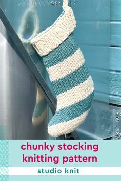 a sock hanging from the side of a blue door with text overlay that reads chunk stocking knitting pattern studio knit