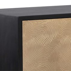 a black and gold cabinet with an abstract design