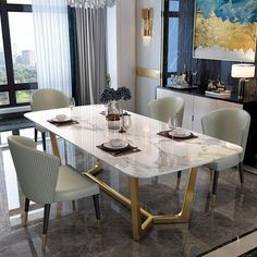 a marble dining table surrounded by white chairs