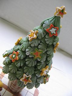 a ceramic christmas tree sitting on top of a table