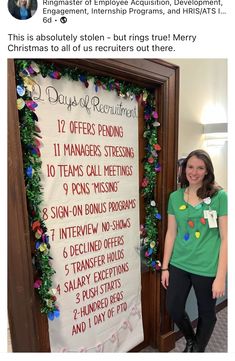 a woman standing in front of a sign that says days of the week on it