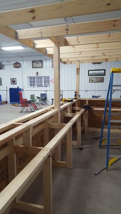 the inside of a building being constructed with wood