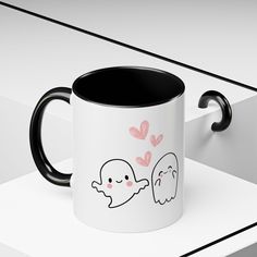 This cute mug featuring a Halloween-themed design with a cute ghost is perfect for adding style and love to your coffee or tea time. Suitable for every occasion, this mug is a great addition to your collection. It is relevant to Halloween celebrations and lovers of cute and whimsical designs. Product features - 11oz and 15oz sizes available - Microwave and dishwasher safe - Vibrant colors with eye-catching contrast - White ceramic with colored interior and handle - Lead and BPA-free Care instructions - Clean in dishwasher or wash by hand with warm water and dish soap Halloween Style, Cute Mug, Wedding Gift Baskets, Halloween Designs, Colored Interior, Halloween Celebration, Halloween Fashion, Cute Mugs, Cute Ghost