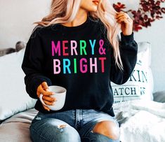 Christmas Shirts for Women Long Sleeve Christmas Sweatshirt for women, Merry and Bright Shirt, Cute Christmas Tshirt, Christmas Crewneck * SHIPS in 1 Business Day! * UNISEX cozy sweatshirts & tees are soft and durable!  * Shop with Confidence! We are a 5-Star Rated Shop operating since 2015! * Easy measuring tip: Take your favorite sweatshirt or tee, lay it on a flat surface and measure the width (armpit to armpit) and length (top to bottom), then compare with our size chart!  * Unisex, classic Christmas Crewneck, Funny Christmas Shirts, Women Sweater, Holiday Sweater, Loose Outfit, Cozy Sweatshirts, Christmas Sweatshirts, Christmas Tshirts, Merry And Bright