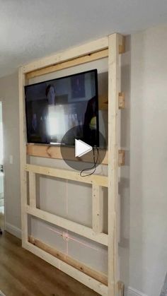 a flat screen tv mounted to the side of a wall