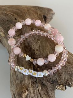 Name, initial or word pale pink beaded gemstone and crystal bracelets Trending Name stretchy bracelets Choose your name, initial, or word. Wear them alone or add them to your stack Item details: This listing is for 3 bracelets as shown in picture This stack is made with 6mm pale pink crystal beads and 8mm pink gemstone beads. At checkout indicate either gold or silver letter beads. Bracelets are made on strong stretchy cording. Average size bracelet is 7 inches. If you have a small wrist 6.5 inc Beaded Name Bracelet, Teacher Bracelet, Crystal Names, Rosary Jewelry, Kids Bracelet, Mom Bracelet, Bracelet Keychains, Pretty Jewelry Necklaces, Word Bracelet