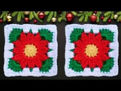 two crocheted squares with red and green flowers on them next to christmas decorations