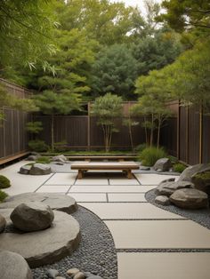 a japanese garden with rocks, gravel and benches