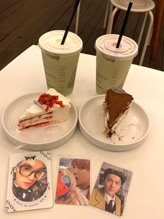 two plates with slices of cake on them next to drinks and cards that say, i love you