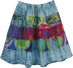 This bright and colorful skirt is sewn in five patches of light weight cotton, with three bright prints and the top and the bottom in tinsel fabric, and then tie dyed in grayish green color. The elastic waistline allows for an adjustable fit, and the skirt is above the knee-length. Easy choice for a fun, special outing. A fun, attractive light-weight cotton voile skirt that has no lining. If you like tie-dye and colors, and looking for a fun summer short skirt, this is it!. Length: 20" approx ; Casual Multicolor Cotton Skirt, Multicolor Cotton Skirt With Elastic Waistband, Colorful Bohemian Cotton Skirt, Casual Multicolor Skirt For Festival, Casual Multicolor Festival Skirt, Summer Cotton Tie-dye Skirt, Summer Cotton Tie Dye Skirt, Cotton Tie Dye Skirt For Summer, Hippie Cotton Skirt For Spring