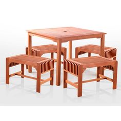 a wooden table and four chairs sitting next to each other