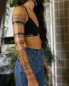 a woman with a tattoo on her arm