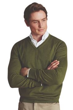 This refined-yet-casual V-neck is crafted from pure, Woolmark-certified Merino wool. Known as nature's performance fabric, Merino is comfortably breathable and temperature regulating - and has the softest handle of any knitwear. We've gently washed it for an even silkier finish, resulting in a supple Sweater that subtly moulds itself to your body.  The styling is simple, letting the fine fibres take centre stage. There's traditional ribbing on the cuffs and hem and the understated neckline means Charles Tyrwhitt, Shirt Model, Christmas Outfits, Centre Stage, Performance Fabric, Moss Green, V Neck Sweater, Christmas Outfit, Vneck Sweater