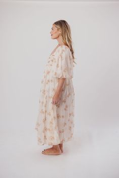 This gorgeous dress is a *vibe* and we are here for it. If you think the Harlow is stunning in photos, wait till you see it in person - this dress will make a statement wherever you go! It features incredible puffed sleeves, a bustier-style structured bodice, and a voluminous skirt. This floral gem is extra-luxe, and 100% the choice when you're looking to stand out from the crowd. Pair it with a glam set of pumps for a night at the symphony, or with heeled sandals for a baby shower - just prepar Flowy Maternity Midi Dress, Summer Maternity Long Dress, Long Summer Maternity Dress, Long Maternity Summer Dress, Summer Maternity Midi Dress With Floral Print, Maternity Floral Print Flowy Midi Dress, Flowy Floral Print Maternity Midi Dress, Maternity Midi-length Floral Print Dresses, A Night At The Symphony