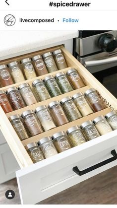 an open drawer with spices in it