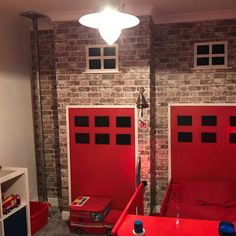 a room with two red doors and a firetruck