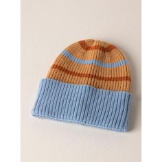 Spruce up your cold weather accessories in Shiraleah's Rory hat. This hat features a cozy knit texture, in a blue, rust and tan stripe making it the perfect addition to any winter outfit. Made from acrylic, nylon and polyester the Rory hat will keep you cozy and chic during the cold winter months. Adjustable Striped Winter Hat, Blue Ribbed Winter Hat, Winter Blue Ribbed Hat, Striped Beanie Hat One Size, Striped Beanie Hat, One Size Fits Most, Winter Striped Hats One Size Fits Most, Striped Winter Hats One Size Fits Most, Blue Soft Knit Hat For Fall, Blue Knitted Hat For Fall