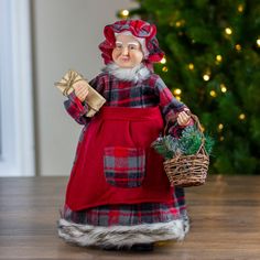 Mrs Claus with basket Christmas figure. Dressed in a plaid dress and hat with a red apron; faux fir trimmed. Accented with a basket filled with frosted pine and pinecones Red Checkered Dress, Red Apron, Red Plaid Dress, Chubby Cheeks, Christmas Baskets, Red Checkered, Bonnet Hat, Checkered Dress, Costumes Ideas