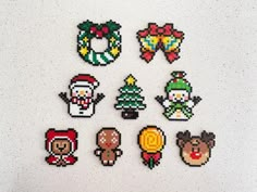 six pixelated christmas stickers on a white surface