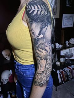 a woman with a tattoo on her arm