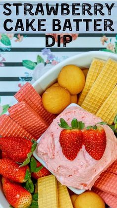 strawberry cake batter dip in a bowl with waffles and strawberries