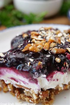 a dessert with blueberries and nuts on top