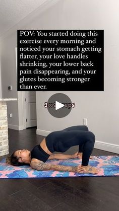 a woman is doing yoga on a mat in front of a brick wall and fireplace