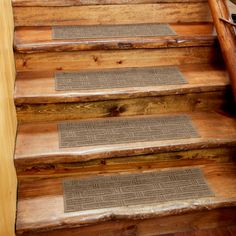 the steps are made out of wood and have mats on them